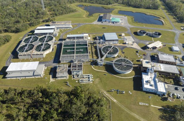 Aerial view of water treatment factory at city wastewater cleaning facility. Purification process of removing undesirable chemicals, suspended solids and gases from contaminated liquid.